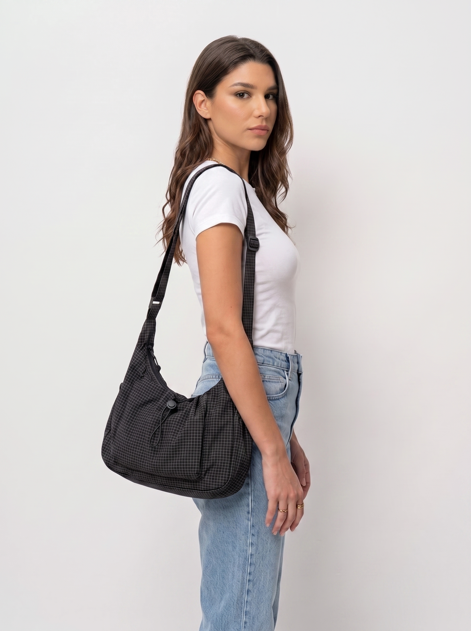 all-groups - The Lucienne Crossbody, worn on the body, side profile